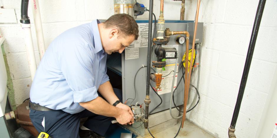 Green Homes Illinois, Technican fixing gas furnace, IL